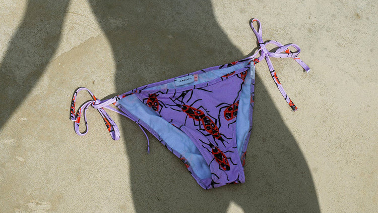 TOMCSANYI beachwear collection – one-piece swimsuits, racer and triangle bikinis in bold, one-of-a-kind prints.