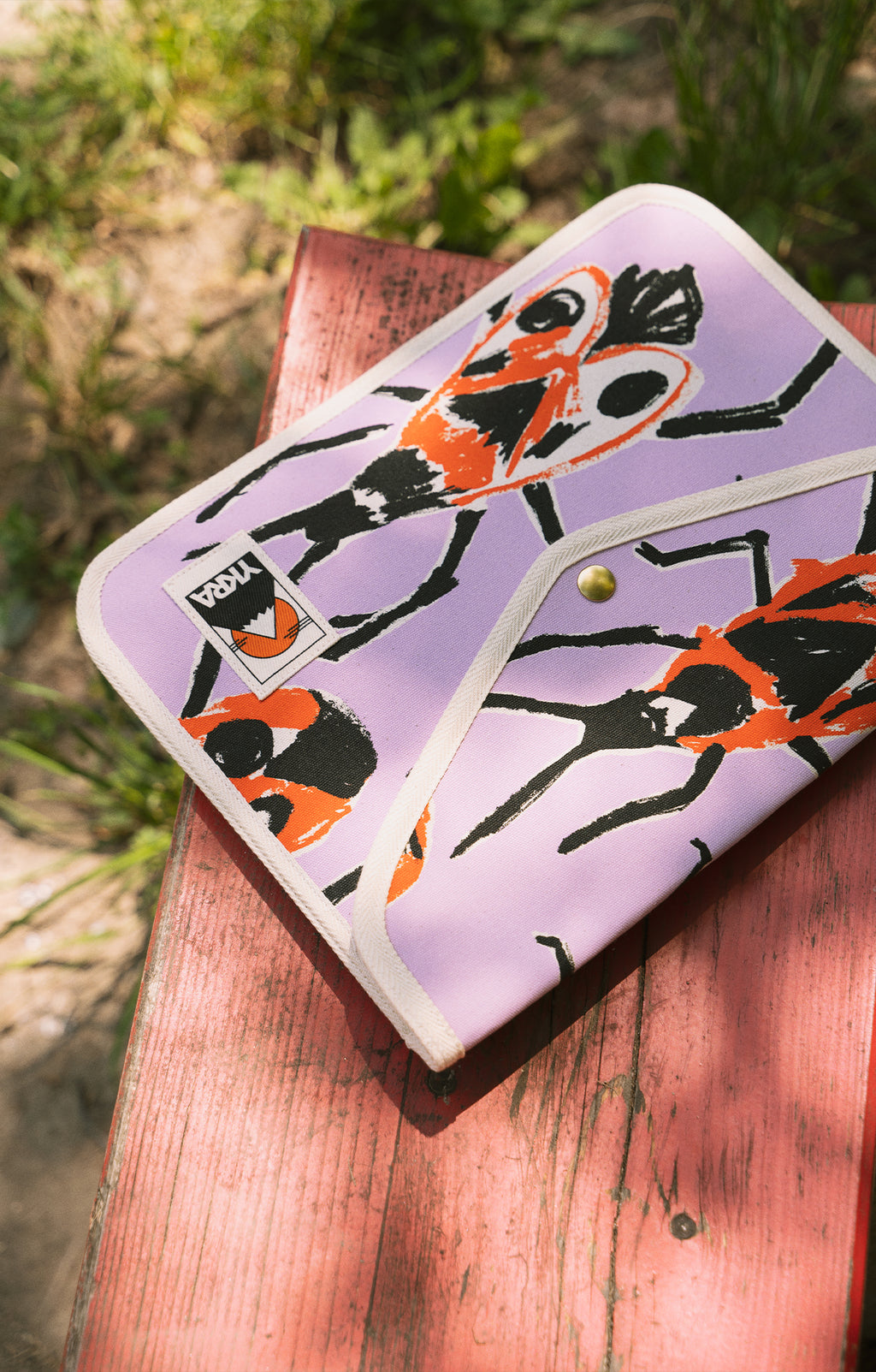 YKRA x TOMCSANYI laptop case 'Small Firebugs'